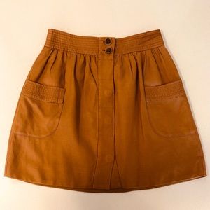 Pleated button-front mini skirt with pockets